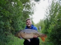 Luke with a nice mirror carp